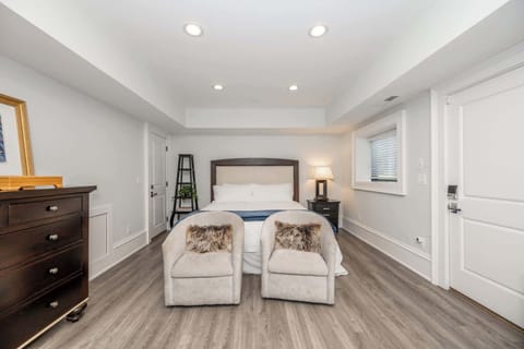 This chic studio features a plush king bed, smart TV, kitchenette, & full bath