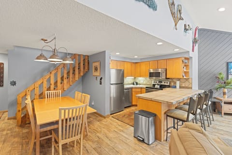 Full kitchen with brand new oven/microwave. Dining table sits 6. Stairs to loft