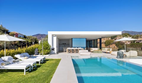 Private swimming pool with sunloungers.