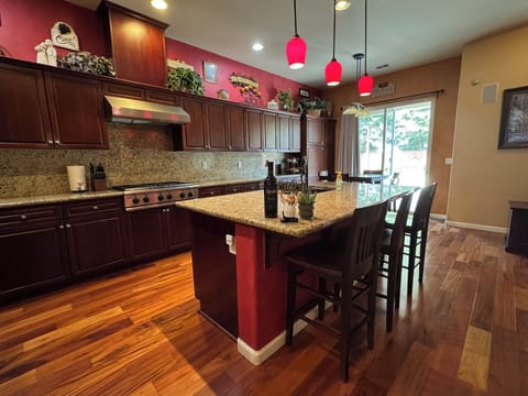 Entrance to the kitchen. Granite countertops, Keurig, KitchenAid, 6-burner stove
