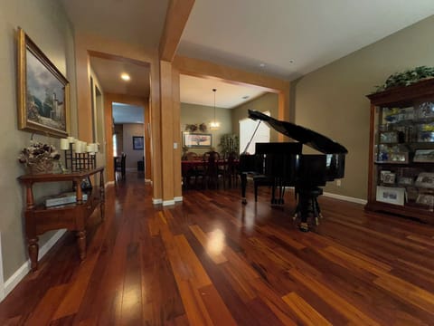 Welcome. As you enter my home you are greeted with beautiful hardwood floors.