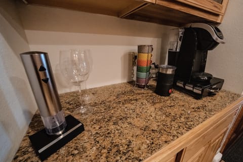 Keurig coffee maker with fully stocked coffee bar.