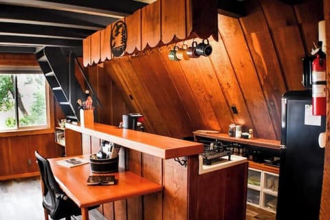 Kitchen bar top & office desk area. Note the steepness of the stairs/ladder
