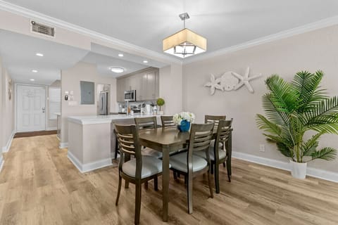 Spacious dining room featuring seating for six.
