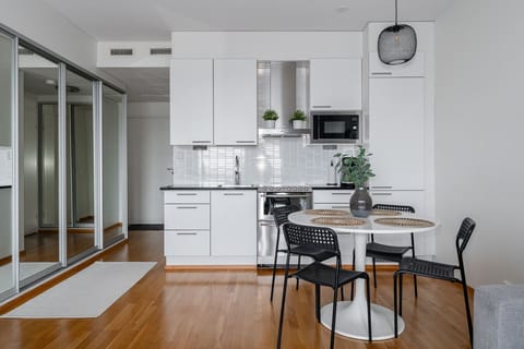 Kitchen is an open concept kitchen equipped with a dishwasher.