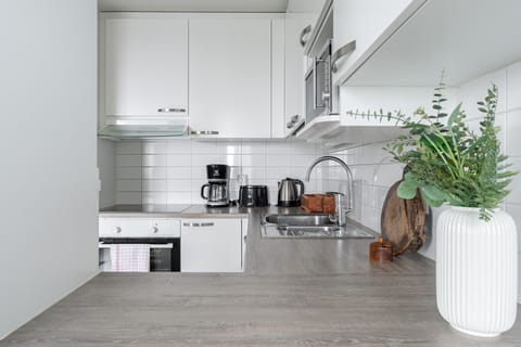 The kitchen has everything you need for cooking, including an oven, stove, microwave, crockery and cutlery.