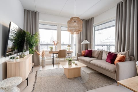 Apartment living room is spacious, modern and bright. The apartment has views to both south and west.