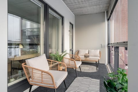 Apartment spacious balcony with glasses and furniture