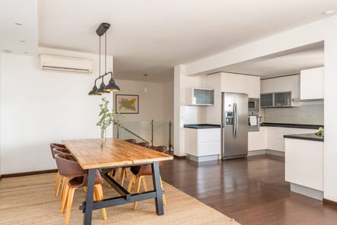 Prepare a feast for your entire group in the fully equipped kitchen. The open-plan design connects seamlessly to the dining area, allowing for easy conversation and a social atmosphere while cooking and enjoying meals together.