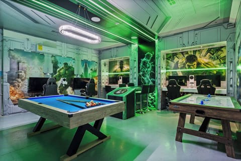 The Avengers themed arcade game room with Xbox consoles and life sized games