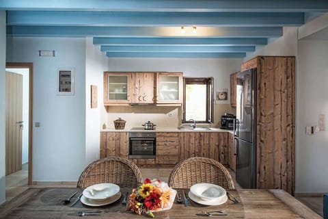 Kitchen Space – Fully equipped with modern appliances and rustic stone details.