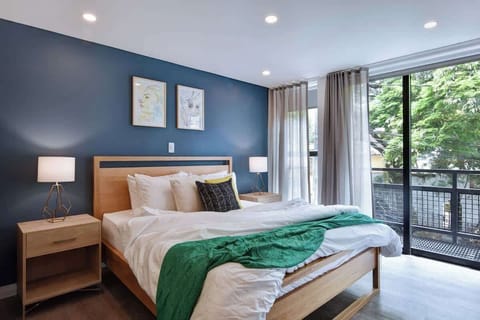Bed and balcony door. There is both a curtain and blackout to assure a good night's sleep. 