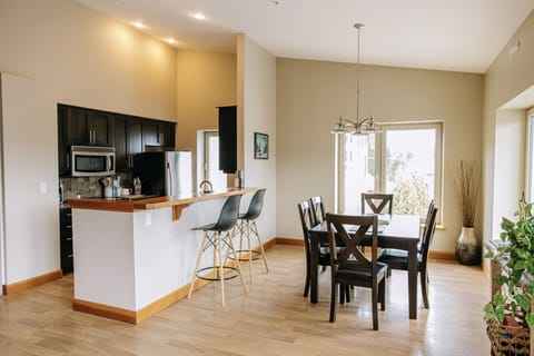 Open concept kitchen/dining area with dining table that seats six
