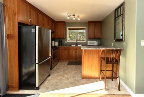 Beautiful well kept kitchen, conveniently located beside the deck!