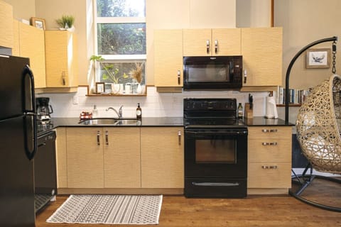 Fully stocked kitchen with lots of natural light and all major appliances.