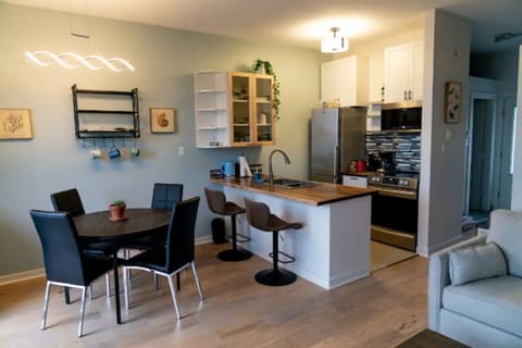 Kitchen island seats two, plus dining table seats 4. Kitchen is fully equipped with everything you need to cook at home.