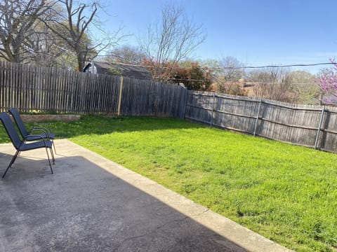 Private Backyard Retreat – Spacious fenced-in backyard for outdoor relaxation.