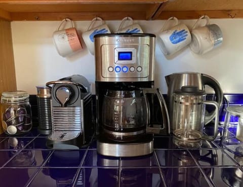 Coffee station includes: drip coffee machine, espresso machine, & french press.