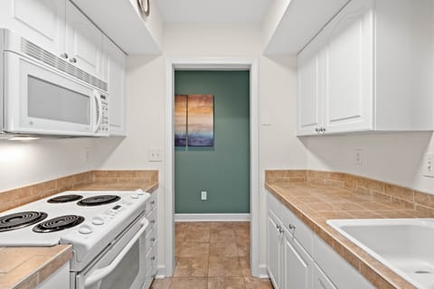 Clean spacious kitchen  equipped with all you need for your vacation at the beach.