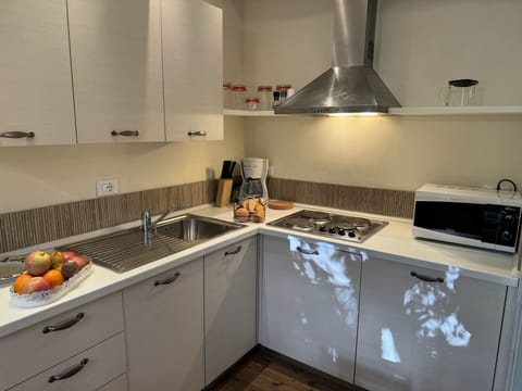 Kitchen, Kitchen Appliance, Countertop, Major Appliance, Kitchen Stove, Stove, Cabinetry, Interior Design, Gas Stove, Kitchen Sink