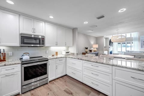 - Open concept kitchen flows into dining and living, keeping everyone connected
- Chic pendant lights and bar seating make this a social hub for guests and family
- Granite surfaces, modern fixtures, and everything within reach