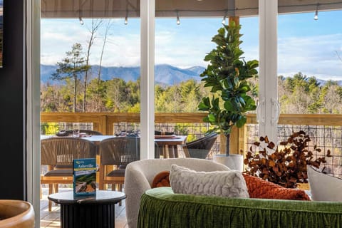 Come up the ramp into the family room &  enjoy the mountain views from here.