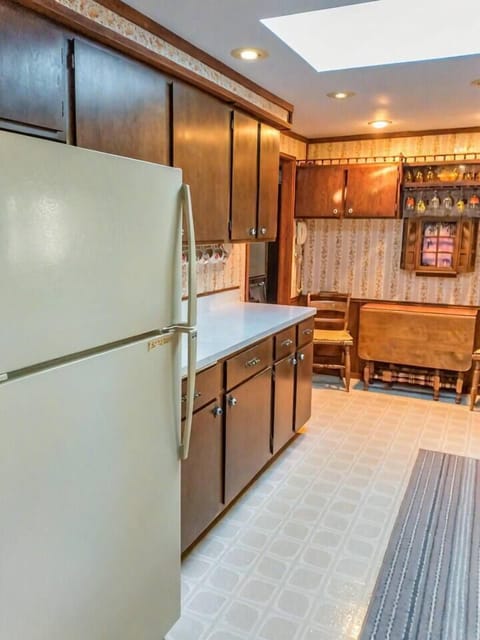 View when walking in from dining area. Fully furnished kitchen.