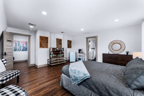 Large one bedroom suite with queen sized bed and attached bathroom