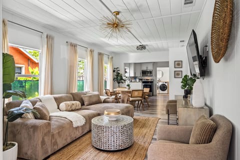 Unwind in Casa Luna's inviting living room, featuring a brand-new, plush couch and a 55-inch flat-screen TV—perfect for cozy evenings or catching up on your favorite shows.