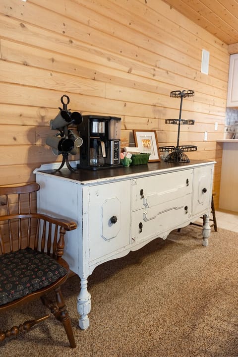 Coffee bar with pot, filters, mugs and sugar. 