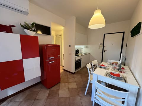 Flooring, Floor, Apartment, Interior Design, Furniture, Room, Kitchen, Cabinetry, Major Appliance, Countertop