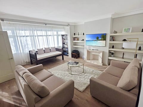 Spacious living room with seating for six and natural light