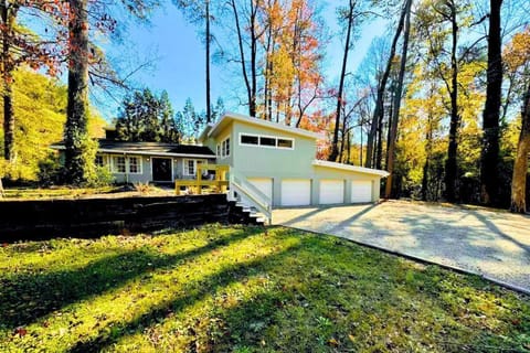 Escape to this stunning modern retreat, nestled among towering trees. 