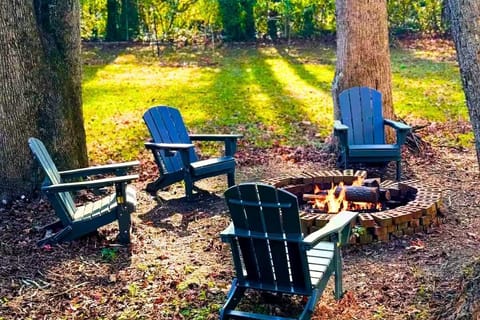 Unwind in this cozy outdoor fire pit area, surrounded by nature