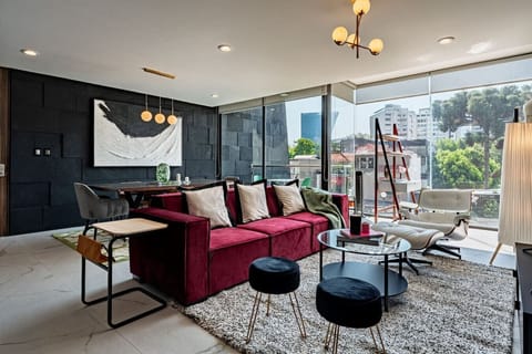 Sun-drenched living room with stylish furniture and access to a private balcony