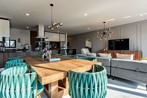 Seamless indoor-outdoor flow from the dining area to the private balcony