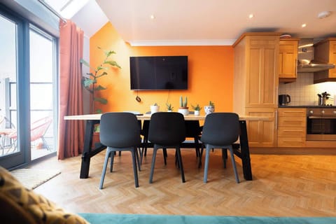 Where dining meets relaxation—enjoy meals and movie nights in this perfect blend of comfort and style.