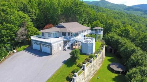 Wake up above the trees at this private Smoky Mountain retreat with epic views, 3 gazebos, and plenty of space to gather. This is where unforgettable memories are made.
