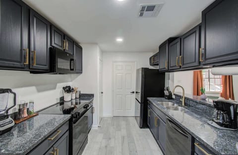 With a functional galley layout and a convenient peek-through window, this fully equipped kitchen has everything you need to whip up a tasty meal for yourself and your companions.