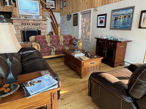 Main floor living room, adjacent to kitchen and dining area.