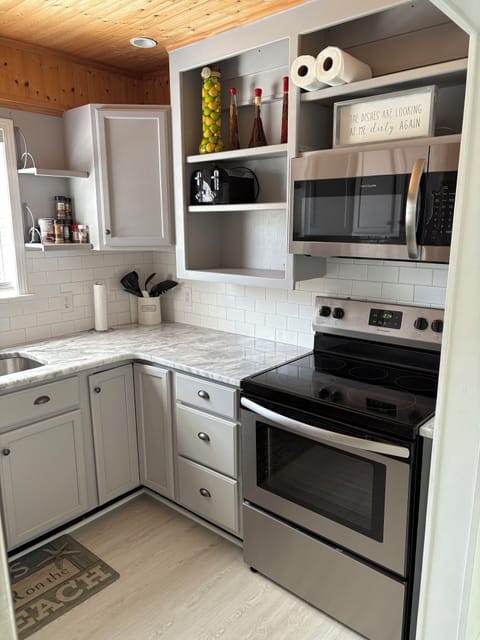 Kitchen - Fully equipped.   Electric stove/oven, microwave, Keurig, etc.