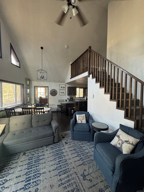 Living room, stairs to loft.