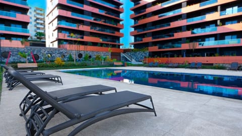 Relax in Funchal with stunning ocean views and a beautiful pool. Enjoy sun loungers by the water in this stylish apartment for a perfect and peaceful getaway. #funchal #apartment #luxury