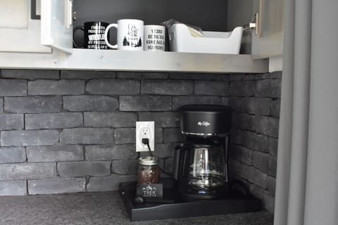 Complimentary coffee provided. Fresh ground medium roast, caffeinated coffee.