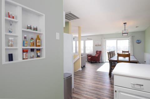Bright, open kitchen and dining area with built-in spice rack