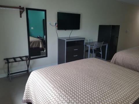 Kick back with in-room TV and simple, functional furnishings.