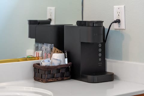 Start your day right with a fresh cup of coffee, brewed just steps from your bed.