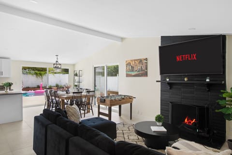 Stylish living area with smart TV and open floor plan