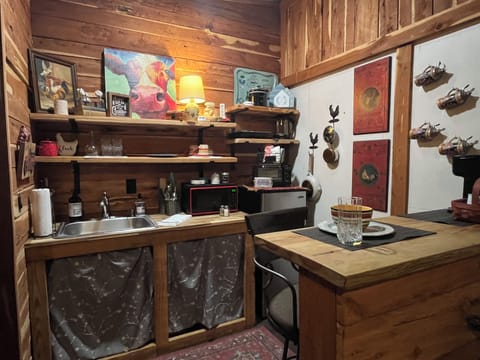 Refrigerator, toaster oven, microwave, single serve coffee maker, tea kettle.