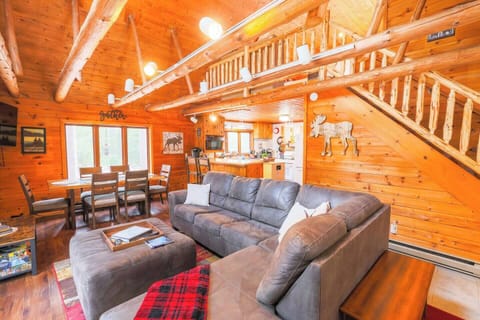 Open Living Room | Great views of the woods | Gas fireplace | Super comfortable sectional couch w/ Queen sleeper | 50" TV | Games & books